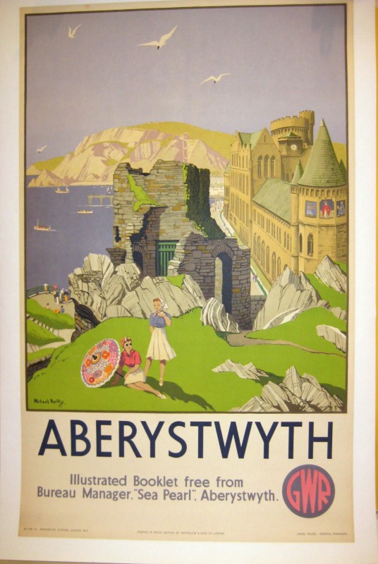 Aberystwyth poster with ruins and a castle on a sea cliff and woman lounging in the grass in the foreground