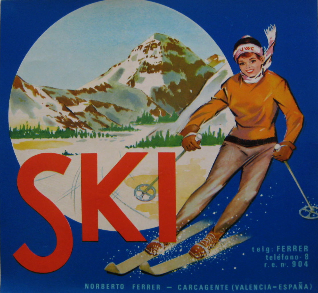 A woman on skis with a mountain behind her