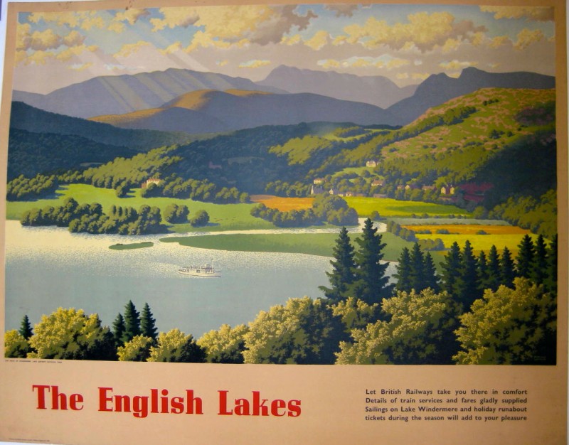 An aerial scene of a lake and mountains