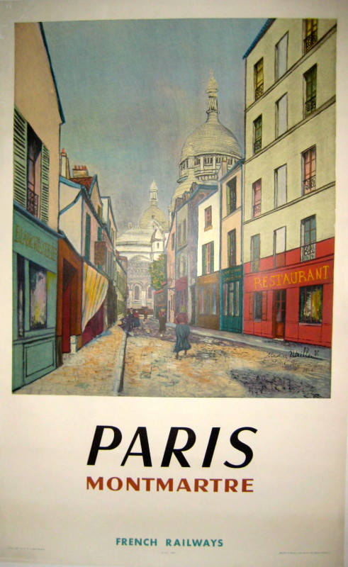 A street in Montmarte Paris with buildings and shops