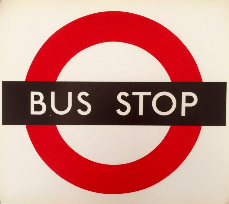 Bus Stop paper sign; London Transport logo, red circle with black cross bar saying bus stop. White background