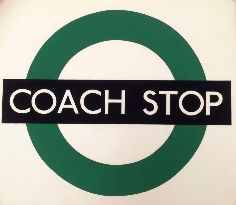 Coach Stop paper sign; London Transport logo, green circle with black cross bar saying coach stop. White background