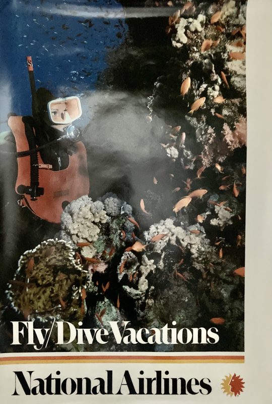 National Airlines poster; diver underwater looking at coral reef and fish.