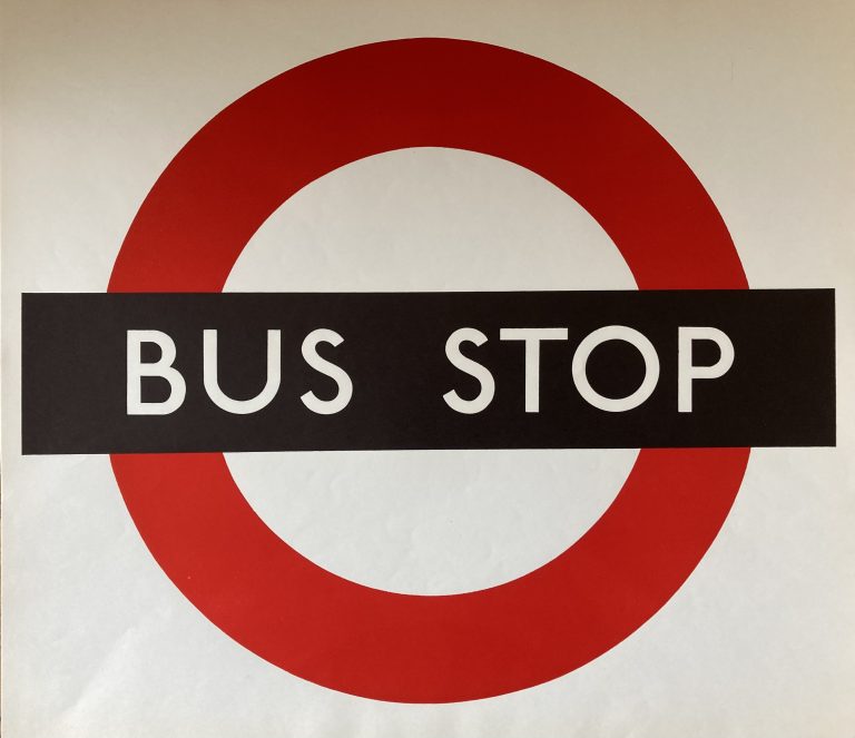 Bus Stop paper sign; London Transport logo, red circle with black cross bar saying bus stop. White background