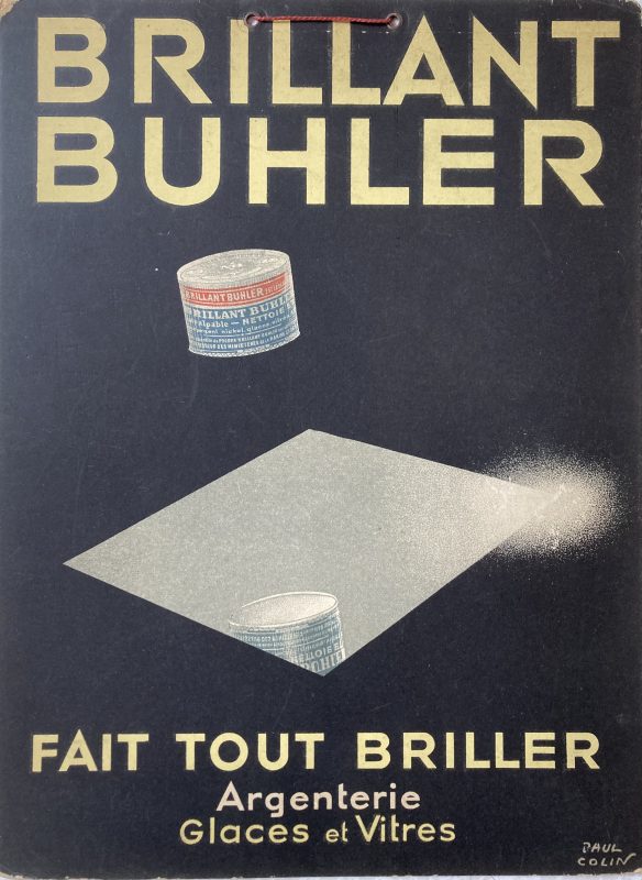 Brillant Buhler card sign; Little tin of cleaning powder is reflected in a mirror. Black background